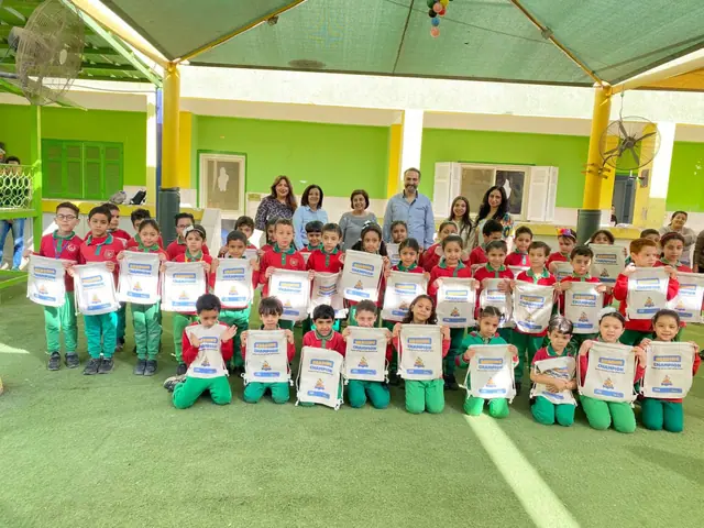 Reading Champion day — students holding their Bee Degree bags with the Learning Rockets team